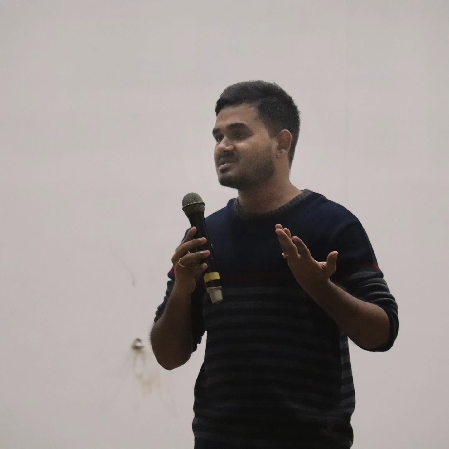 Yaswanth speaking with a mic